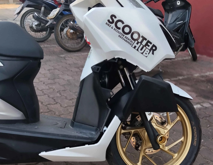 a severely damaged scooter hub bike that was involved in a major accident